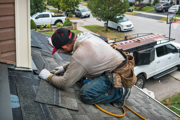 Professional Roof Replacement technician working in Alma, MI